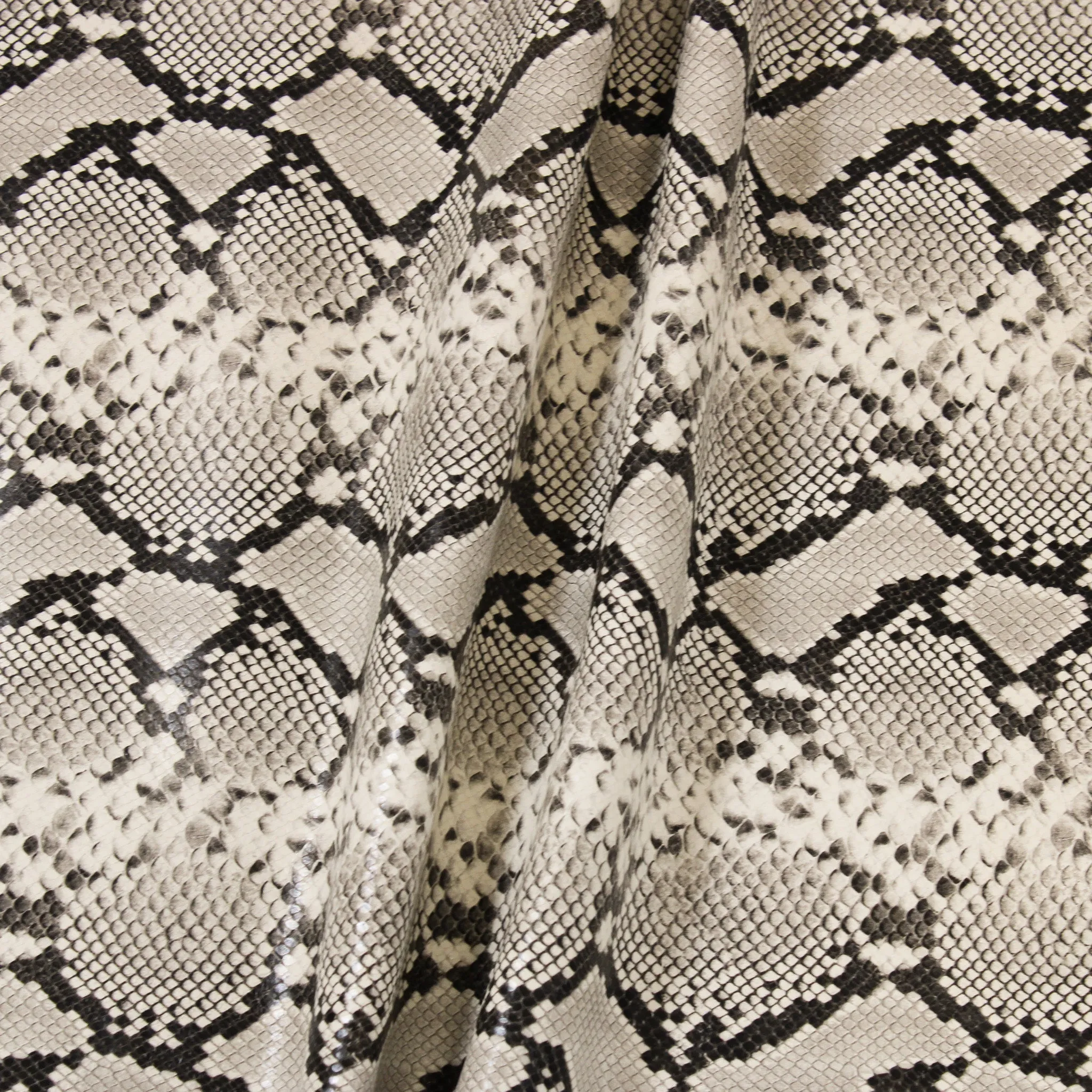 CREAM EMBOSSED SNAKE PRINT COW HIDE